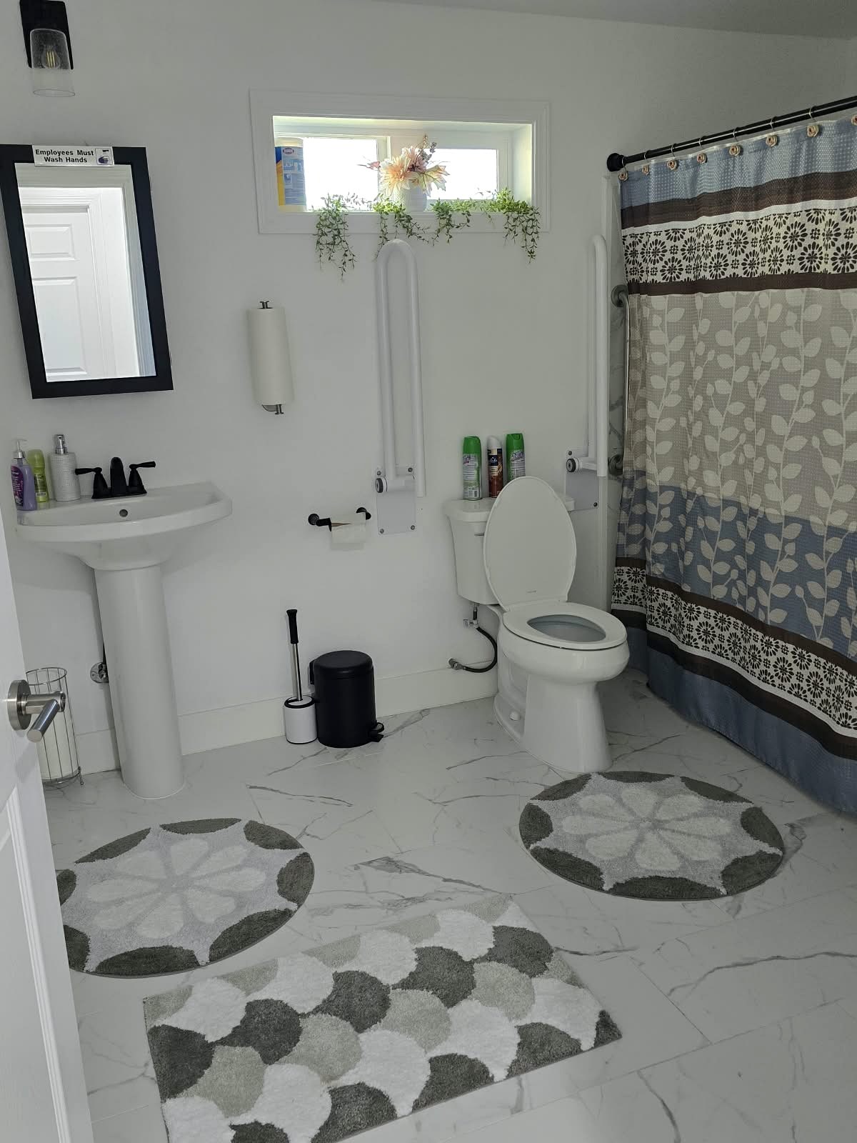 Tevah bathroom with grab bars and a shower area