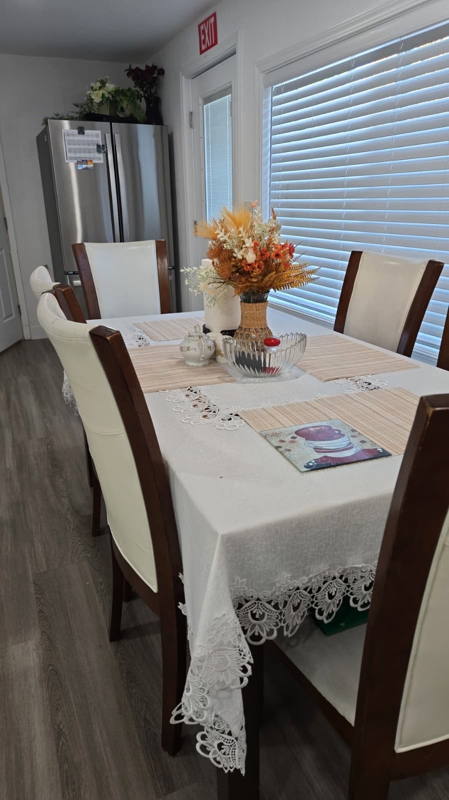 Tevah dining table beside a window